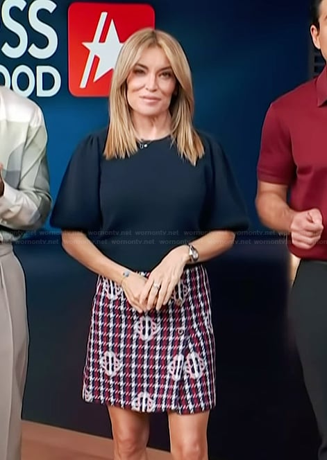 Kit's navy puff sleeve top and mini skirt on Access Hollywood