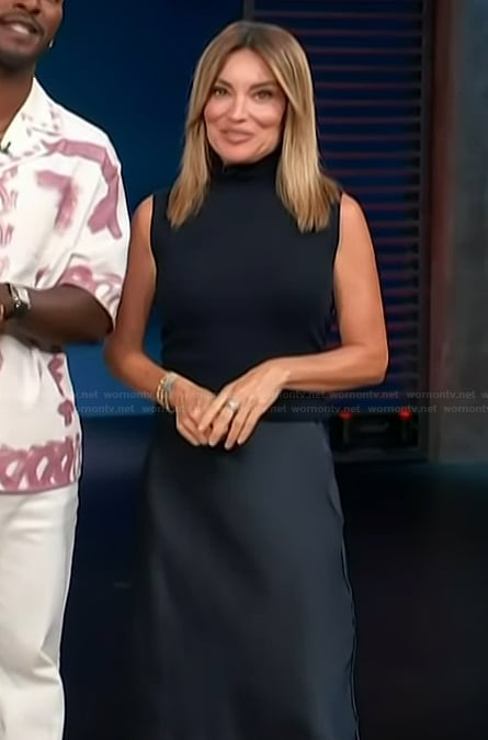 Kit's navy vest and satin skirt on Access Hollywood