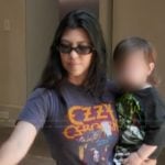 Kourtney’s black Ozzy graphic tee on The Kardashians