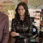 Mabel’s black leather grommet detail coat on Only Murders in the Building