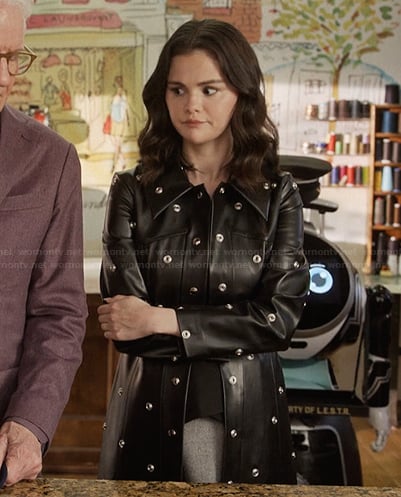 Mabel’s black leather grommet detail coat on Only Murders in the Building