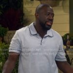 Malcolm’s light blue polo shirt on The Neighborhood
