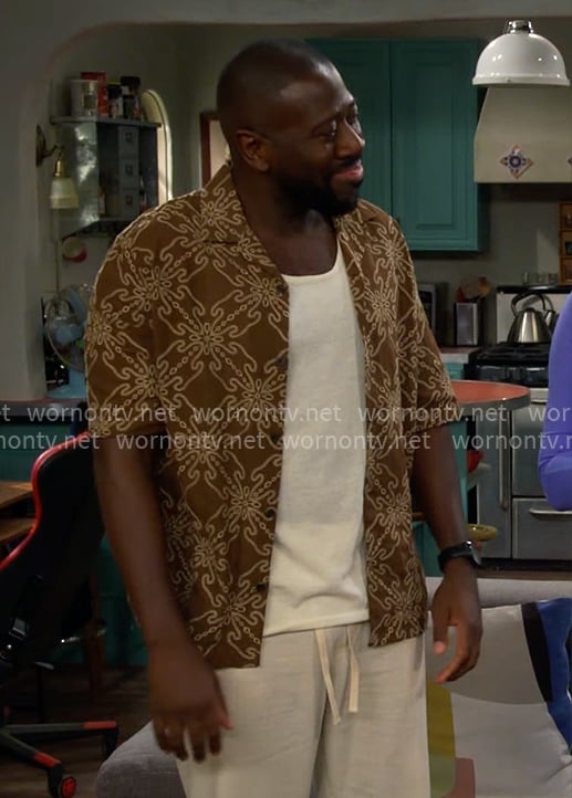 Malcolm's brown embroidered shirt on The Neighborhood