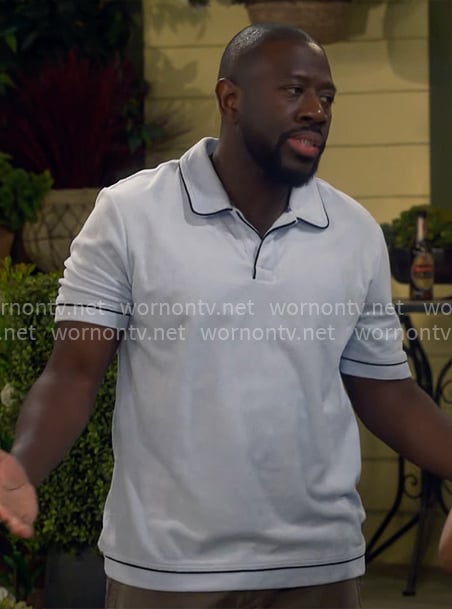 Malcolm's light blue polo shirt on The Neighborhood