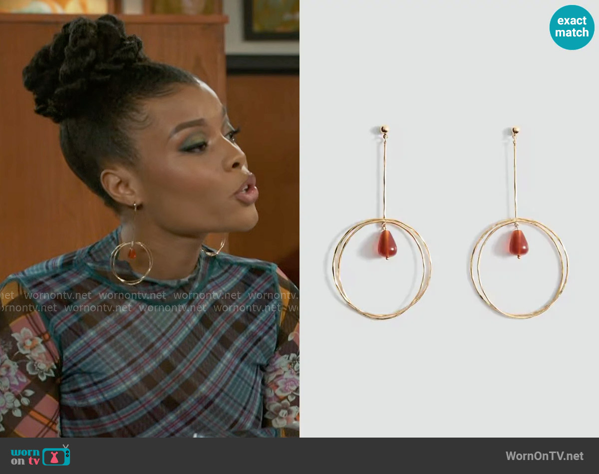 Mango Hanging hoop earrings with ball detail worn by Eva Thomas (Ambyr Michelle) on Beyond the Gates