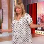 Melissa Peterman’s white printed mini dress on Sherri
