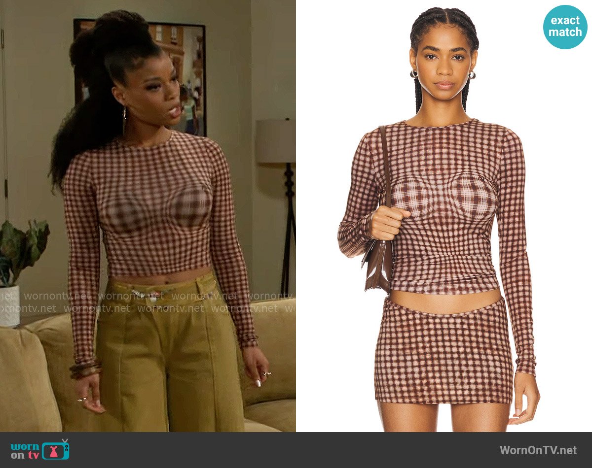 Miaou Long Sleeve Tee in Warped Plaid worn by Eva Thomas (Ambyr Michelle) on Beyond the Gates