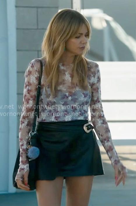 Morgan’s white floral mesh top and leather wrap skirt on High Potential