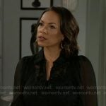 Nicole’s black embroidered blouse and ruffle hem skirt on Beyond the Gates