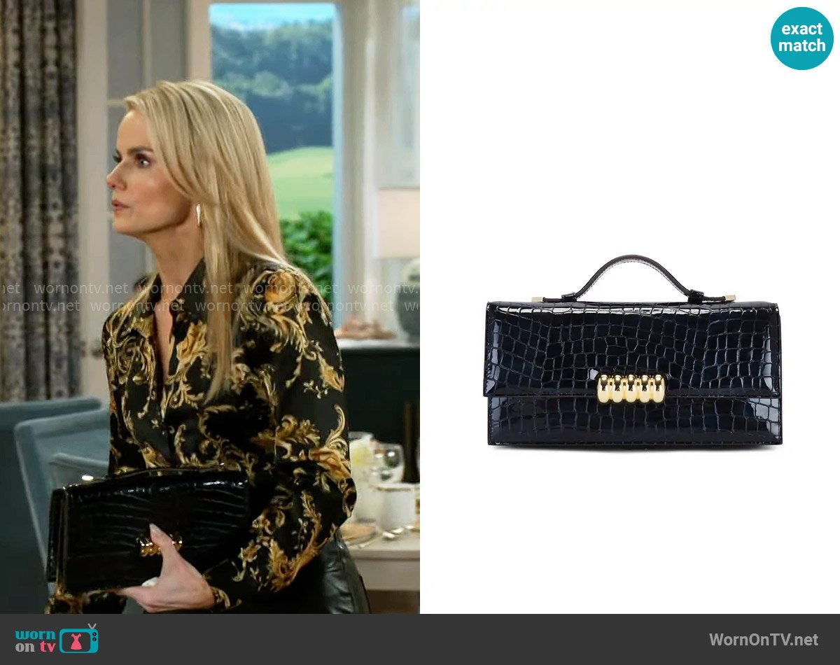 Retrofete Phoebe Clutch worn by Vanessa McBride (Lauren Buglioli) on Beyond the Gates