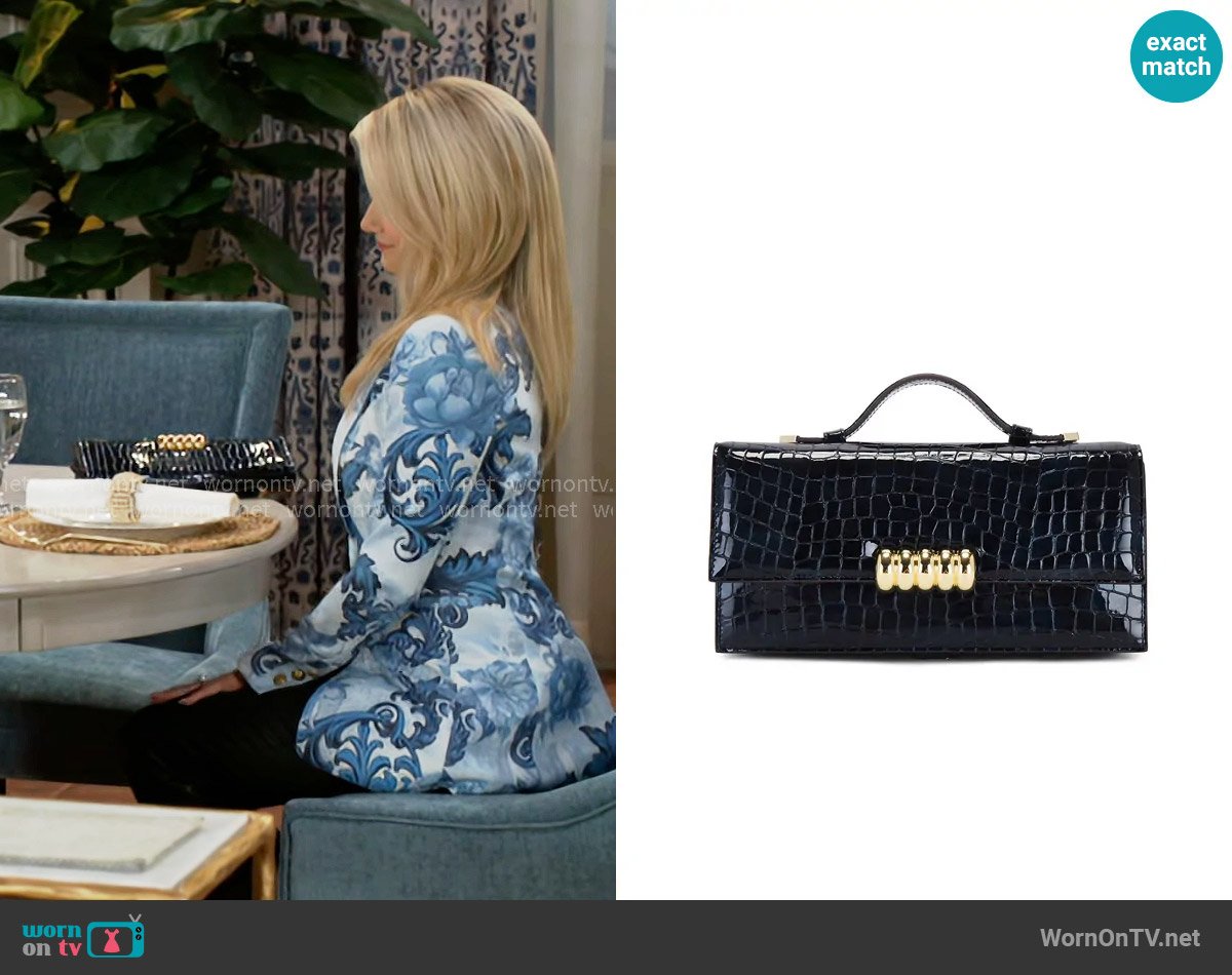Retrofete Phoebe Clutch worn by Vanessa McBride (Lauren Buglioli) on Beyond the Gates