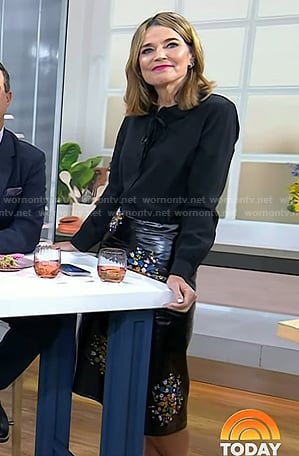 Savannah’s black tie neck blouse and floral leather skirt on Today