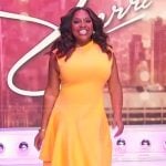 Sherri’s yellow asymmetric dress on Sherri