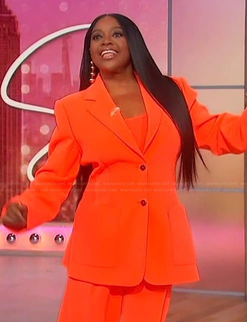 Sherri's orange blazer and pants on Sherri