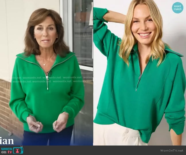 Spanx AirEssentials Half Zip in Field Green worn by Janet Shamlian on CBS Evening News