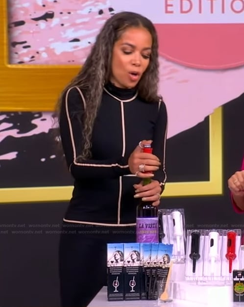 Sunny’s black contrast stripe turtleneck dress on The View