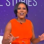 Tamron’s orange belted vest on Tamron Hall Show
