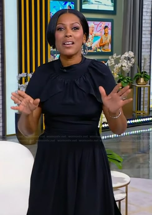 Tamron’s black cape dress on Tamron Hall Show
