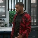 Andre’s red and black printed cardigan on Beyond the Gates