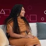 Perla Figuereo’s brown ruched dress on Access Hollywood