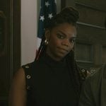 Julia’s black grommet belted dress on Elsbeth