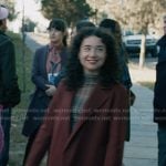 Marissa’s plaid mesh top and burgundy coat on Elsbeth