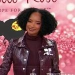 Janell Stephens’s burgundy leather jacket and mini skirt on Sherri