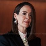 Carr’s silver tear drop earrings on Alls Fair