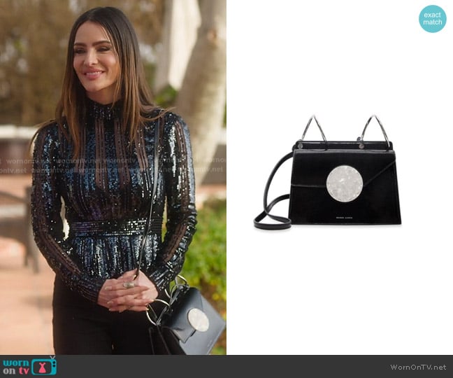 Danse Lente Phoebe Bis Accordion Patent Leather Bag worn by Sandra Vergara on Selling Sunset