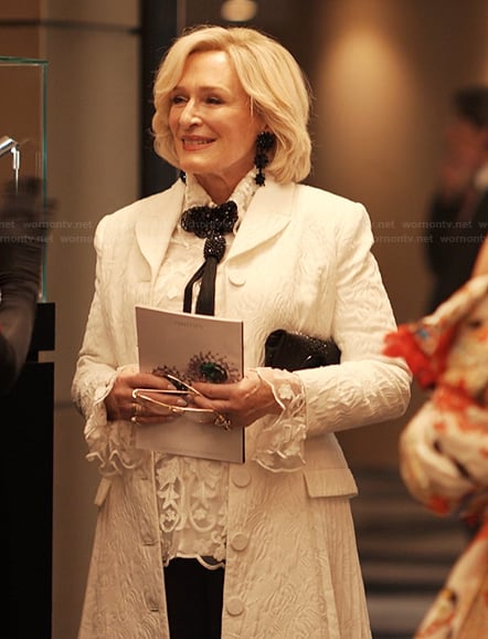 Dina's white jacquard pleated coat on Alls Fair