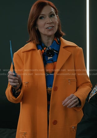 Elsbeth's blue print blouse and orange coat on Elsbeth