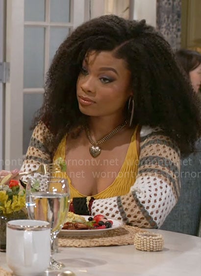 Eva's yellow textured tank top and crochet shrug sweater on Beyond the Gates