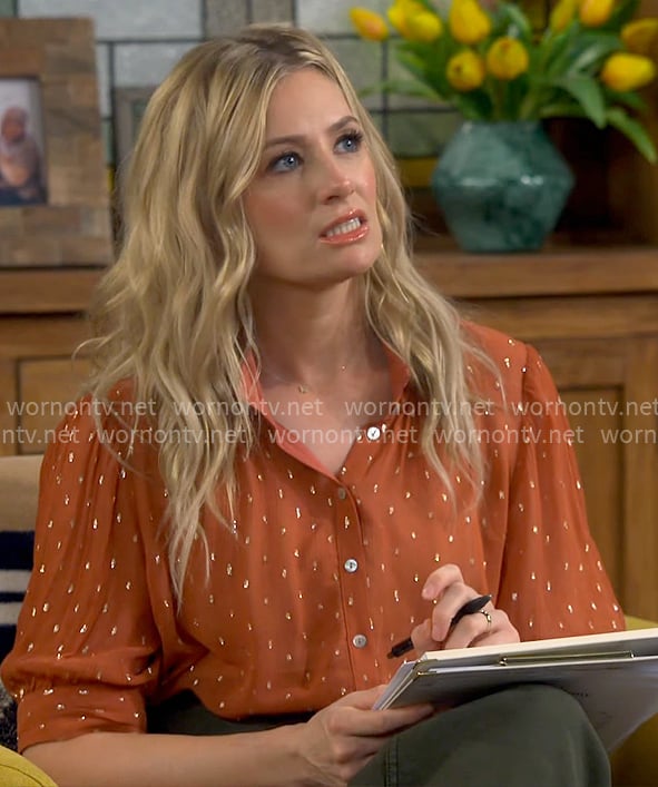 Gemma's orange dot print blouse on The Neighborhood