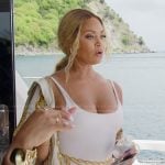 Gizelle’s white chain print swimsuit on The Real Housewives of Potomac