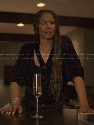 Jax’s black cutout cardigan on Reasonable Doubt