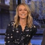 Kelly’s navy dotted tie neck blouse on Live with Kelly and Mark