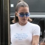 Khloe’s white cropped tee and sunglasses on The Kardashians