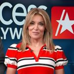 Kit’s red stripe polo on Access Hollywood