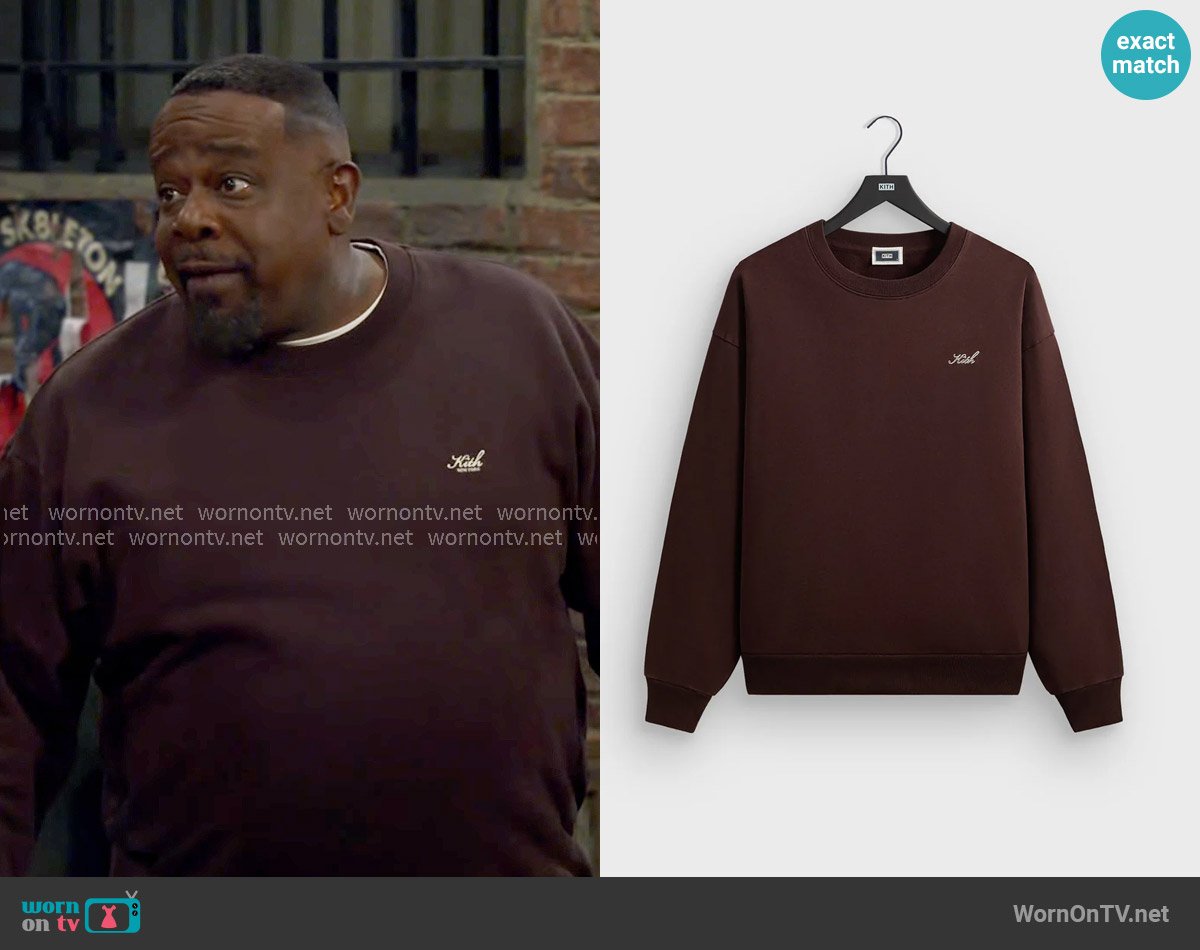 Calvin’s brown Kith sweater on The Neighborhood