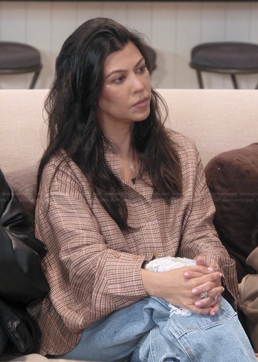 Kourtney’s brown check print top on The Kardashians