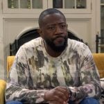 Malcolm’s painted print sweater on The Neighborhood