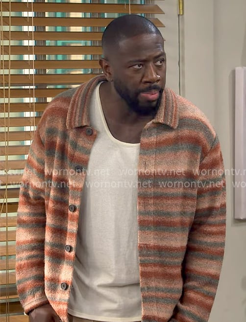 Malcolm's coral striped overshirt on The Neighborhood