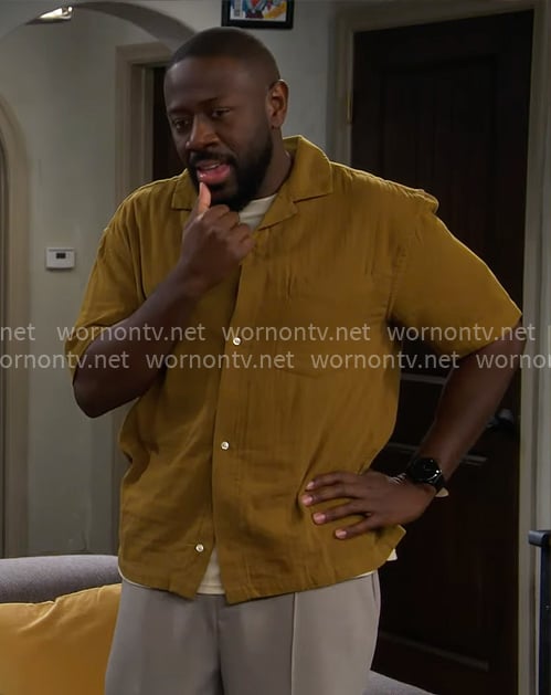 Malcolm’s mustard button down shirt on The Neighborhood