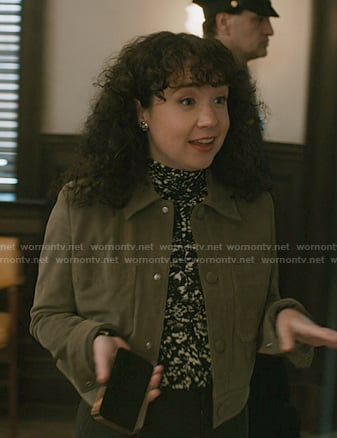 Marissa's abstract print top and green suede jacket on Elsbeth