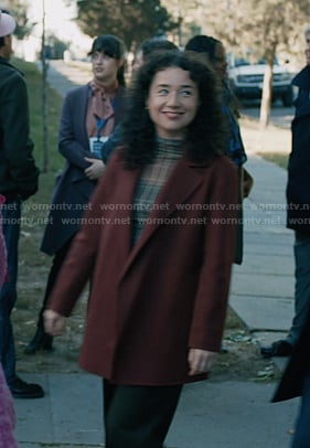 Marissa’s plaid mesh top and burgundy coat on Elsbeth