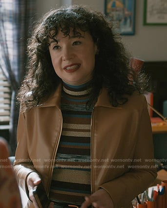 Marissa’s striped sweater and beige leather jacket on Elsbeth