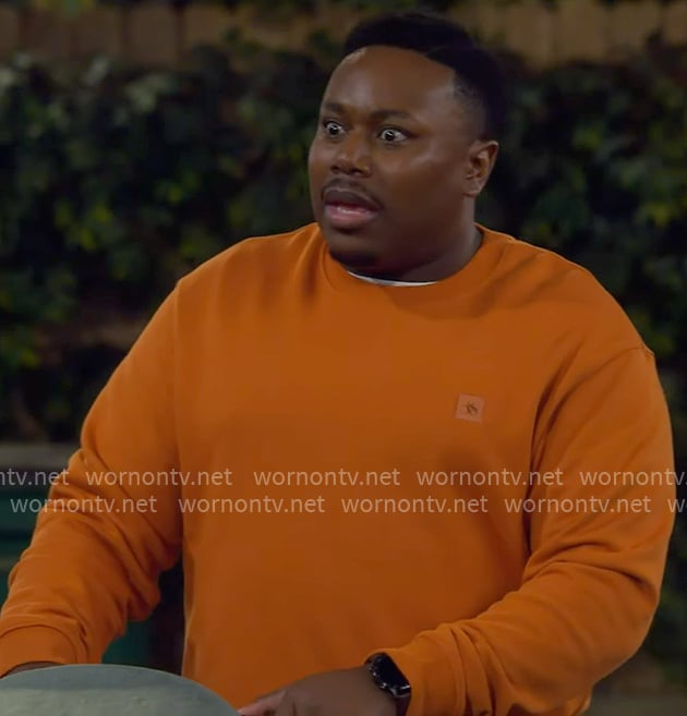 Marty’s orange sweatshirt on The Neighborhood