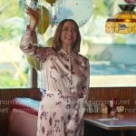 Molly’s pink floral shirt and pleated skirt on Loot