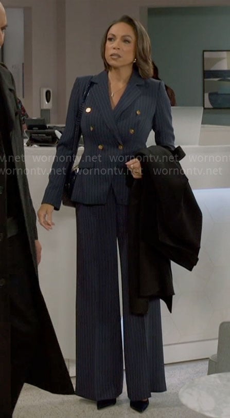 Nicole's navy pinstripe suit on Beyond the Gates