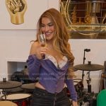 Chrishell’s purple top and skinny jeans on Selling Sunset